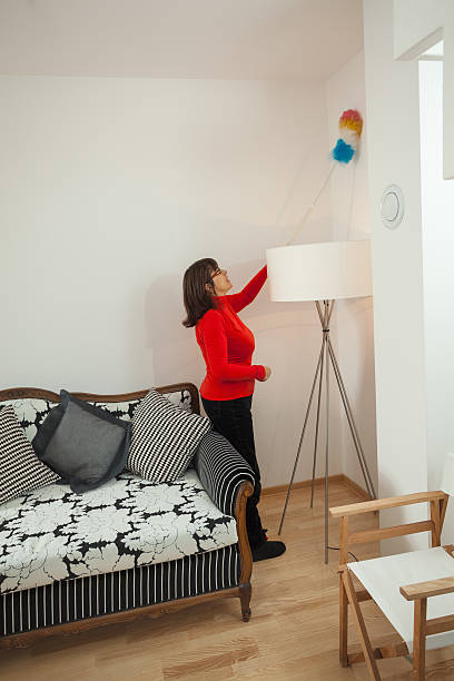 istock Mature woman cleaning her home 165211640