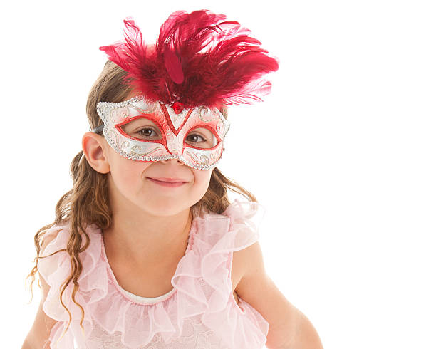 Young girl wearing a Mardi Gras costume. Studio shot, isolated on white background with room for text. 