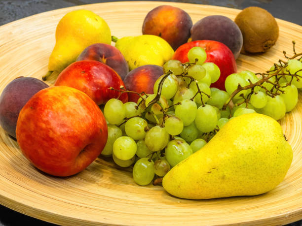 istock fruits plate with fresh grapes, pears, apples 1652129638