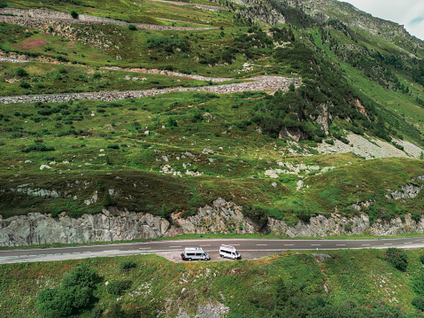 Scenic aerial view of camper van on mountain pass road  in Switzerland