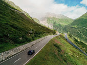 Aerial view of car on the mountain road in Switzerland