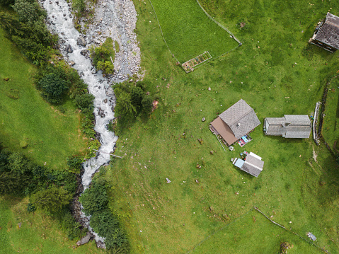 Aerial view of idyllic Stäubifall waterfall and village in Swiss Alps