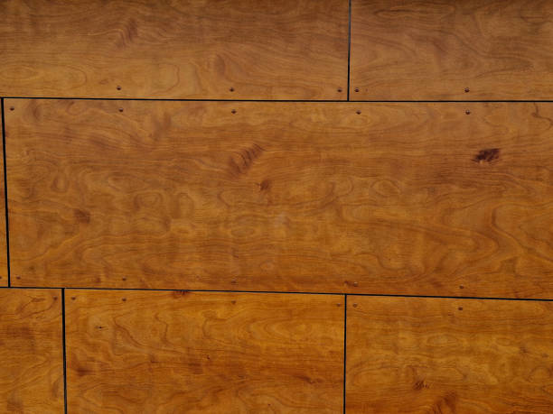 istock wall cladding using natural wooden boards. veneered plywood in rectangular boards warms the surface of the walls 1652163157