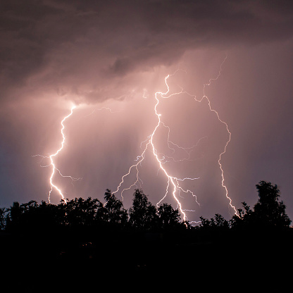 Thunder, lightnings and rain during summer storm at night.