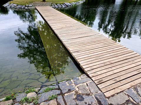wooden bridge over the garden pond