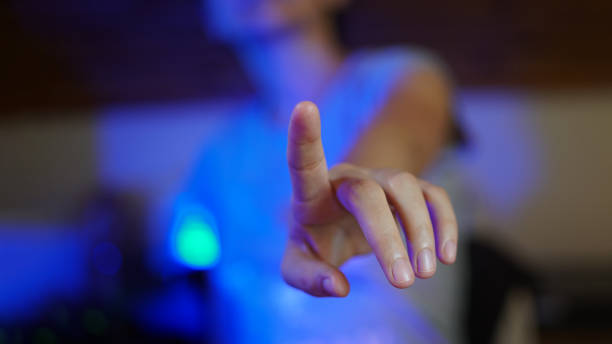 Woman hand touching the screen with her index finger for digital overlay