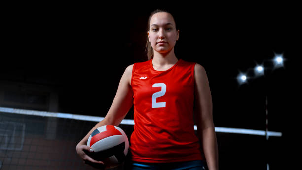 istock Woman holding volleyball 1652222141
