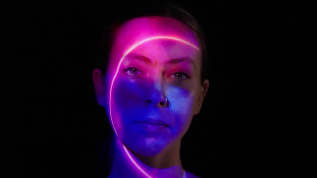 Neon lights on a woman's face