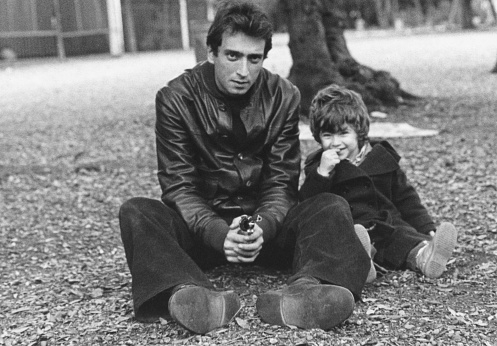 Father and son  in a public park., 1980.