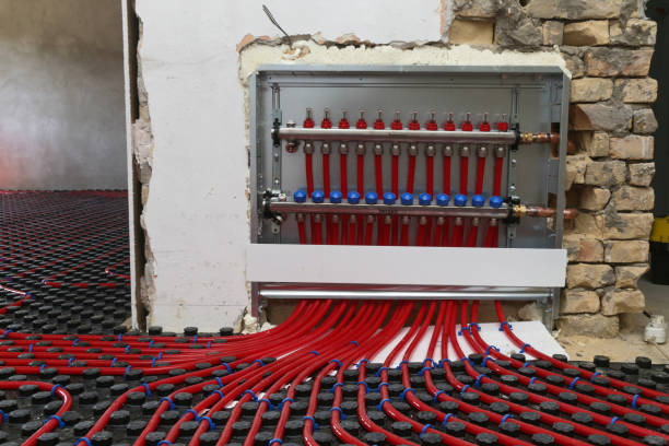 istock Main control manifold of house heating system, work in progress on construction site for a flat residence building 1652242878