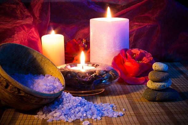 istock three candles camellias stones and salt 165225431