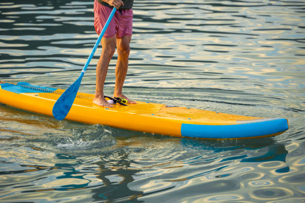 istock Man on sub board floating on ocean sea. 1652305608