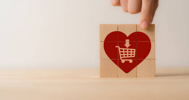 istock Customer engagement, increasing customer loyalty concept. Building relationships, increase brand awareness, and drive sales. Wooden cube blocks with red hearts and customer loyalty icon on background. 1652312832