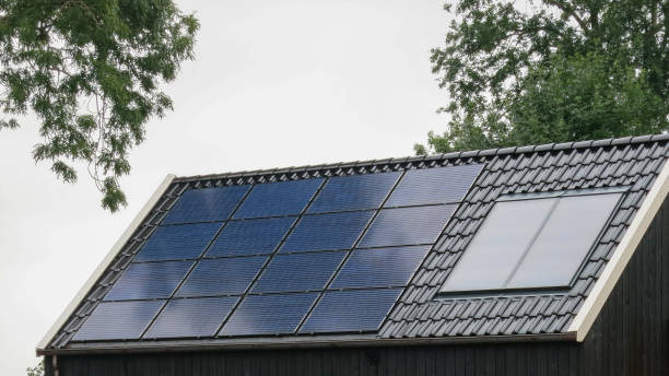 istock Solar panels on house roof energy efficiency 1652322663