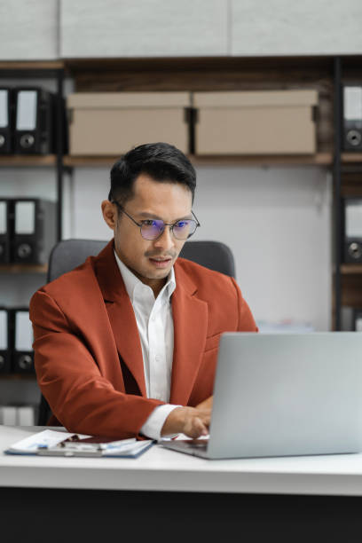 istock Male writes information businessman working on laptop computer writing business plan while sitting in office. 1652323346
