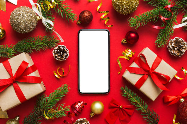 istock Digital phone mock up with rustic Christmas decorations for app presentation top view with empty space for you design. Christmas online shopping concept. Tablet with copy space on colored background 1652323537