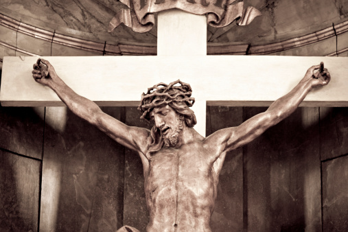 Stone crucifix inside a mausoleum