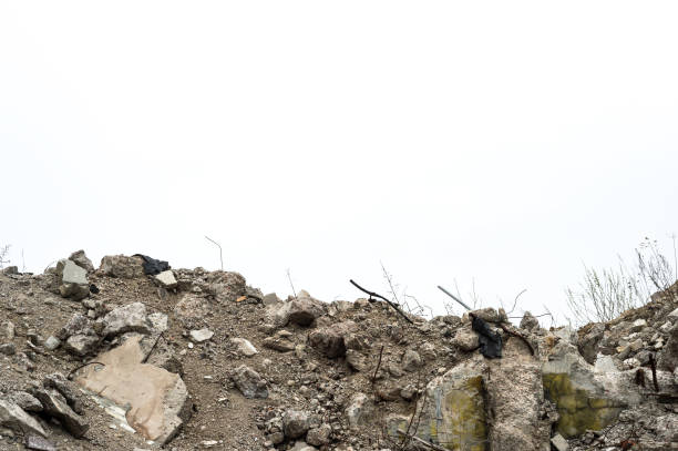istock A mound of concrete rubble and construction debris against a gray sky. Background 1652331316
