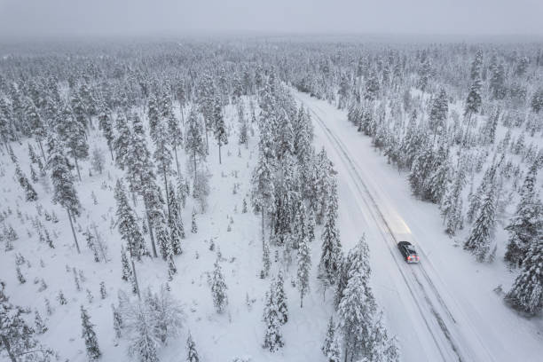 istock Car travelling throught the winter forest, Lapland 1652367754