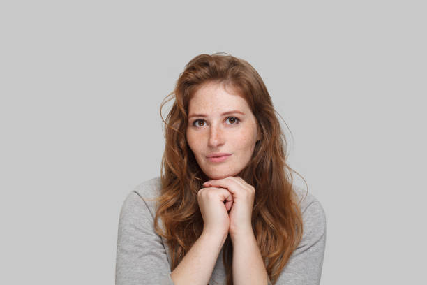 istock Pensive lady on white background, studio portrait 1652372514