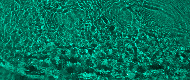Abstract background with emerald waves and ripples