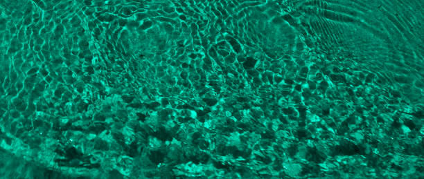 Abstract background with emerald waves stock photo