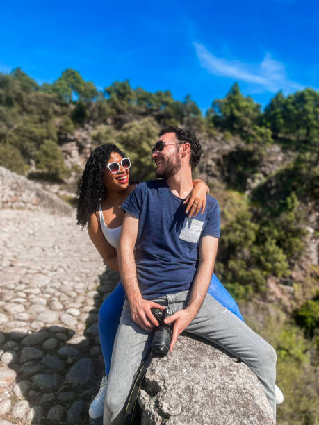 istock couple looking at each other and smiling sitting 1652376012