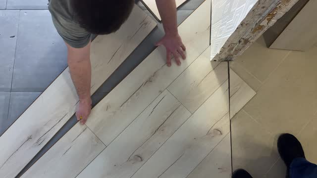 Professional laying of laminate. Repair work in the house. View from above.