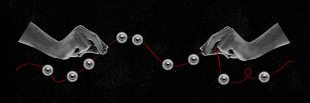 istock Black and white image of human hands holding red thread with eyes. Contemporary art collage. 1652422712