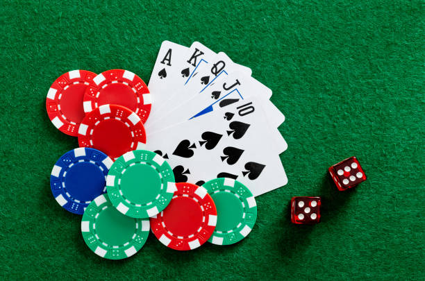 istock Playing cards and gambling chip on the table 1652456399