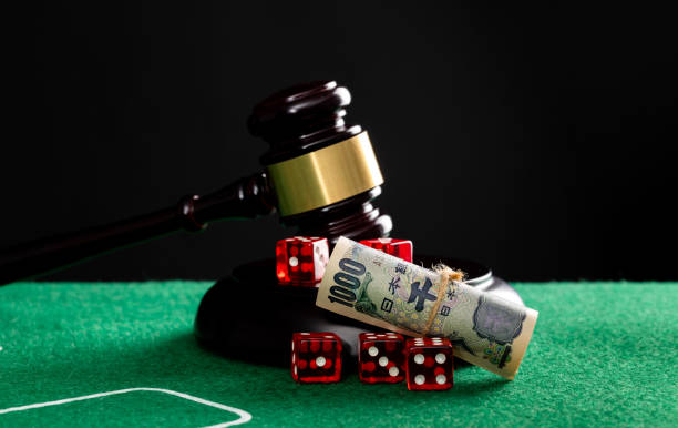 istock Gavel and red dices on the table 1652462594