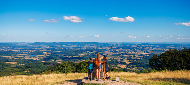 Hiker family enjoying panoramic view from the mount Beuvray in the Morvan- France (Burgundy, Nievre, Saone et Loire)