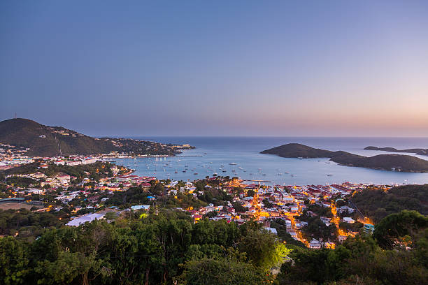 Sunset over Charlotte Amalie St Thomas Sunset over the harbor of Charlotte Amalie in St Thomas with view over town and yachts in bay virgin islands photos stock pictures, royalty-free photos & images