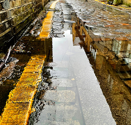 Reflections on flooded cobblestones