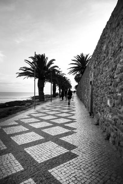 Beautiful cobblestone Promenade at Praia da Luz, Algarve Praia da Luz, Algarve, Portugal- October 20, 2022: Beautiful cobblestone promenade at Praia da Luz, Algarve, Portugal luz solar stock pictures, royalty-free photos & images