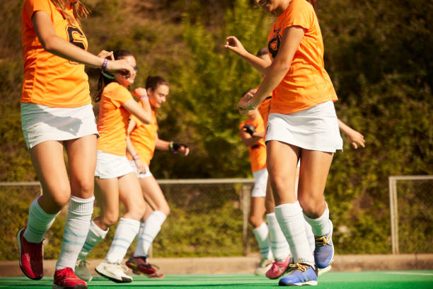 istock Team Warm-Up: Female Hockey Squad Prepares for Practice 1652493704