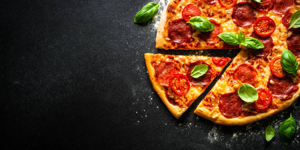istock Traditional italian pizza with salami cheese, tomatoes and basil. 1652498687