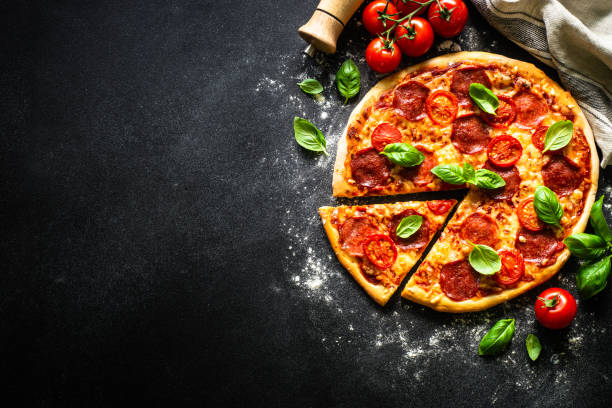 istock Traditional italian pizza with salami cheese, tomatoes and basil. 1652499217