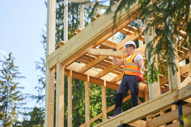istock Strong male builder, holding, raising, carrying wooden board, gilder, looking forward. 1652499814