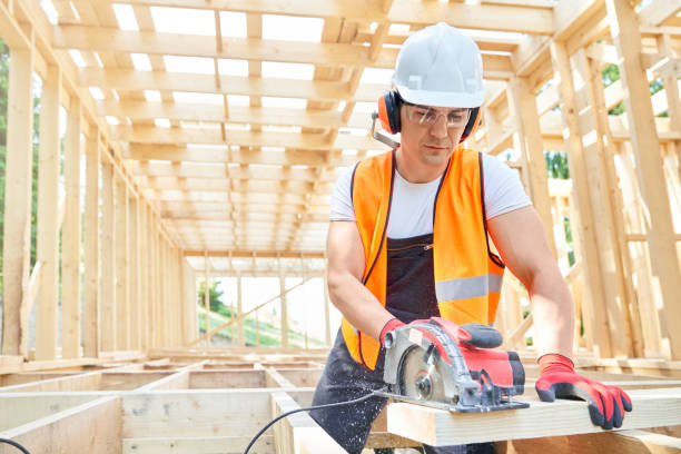 istock Craftsman, builder standing, looking down, cutting wodden gilder by professional equipment. 1652500371