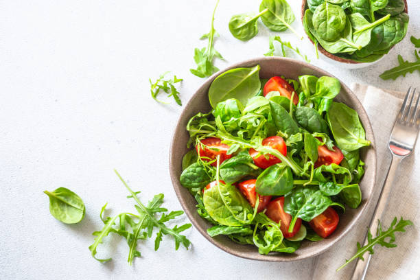 istock Green salad with fresh leaves and tomatoes. 1652501471
