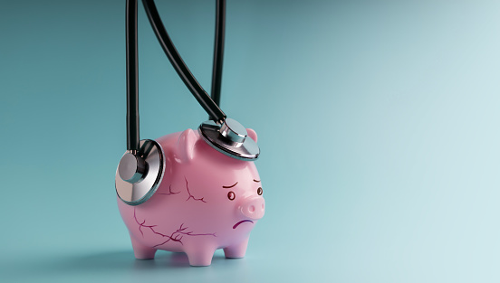 Economic Crisis Concept. Emergent Meetup, Finanacial Checkup, Review with a Financial Expert Doctor for Examination of Valuable Financial, Money, Cost, Debts, Retirement. a Cracked Depressed Piggy Bank with more Stethoscopes