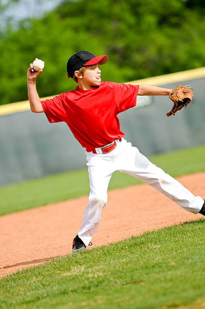 istock Little league baseball player 165250443