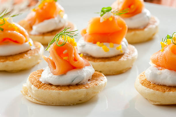 Salmon appetizers Salmon appetizers canape stock pictures, royalty-free photos & images