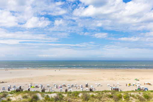 On the beach in Spiekeroog on the North Sea in summer, East Frisian island