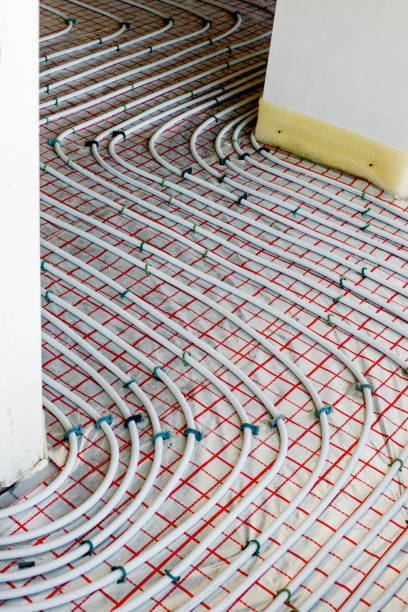 istock Installation of underfloor heating pipes for water heating. Heating systems. Pipes for underfloor heating. 1652517605