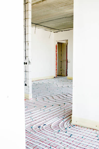 istock Installation of underfloor heating pipes for water heating. Heating systems. Pipes for underfloor heating. 1652518123