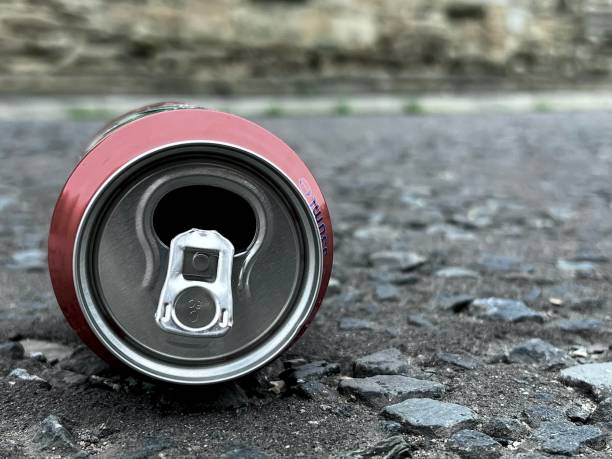 istock Discarded soft drinks can on the dirty streets of England 1652520406