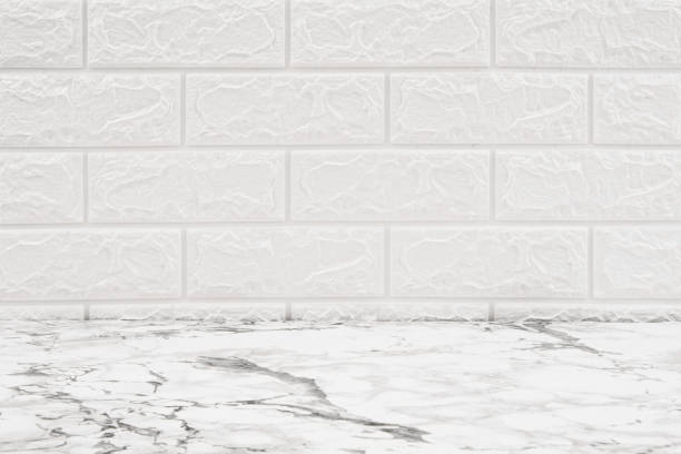 istock White rectangle mosaic tiles texture background and copy space. Marble table and white tiles wall in kitchen or bathroom . Household concept. 1652532131