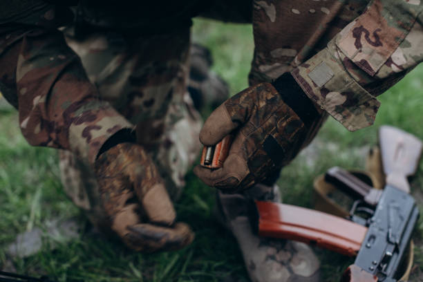 istock Closeup uf Ukrainian soldier loading his weapon 1652532160